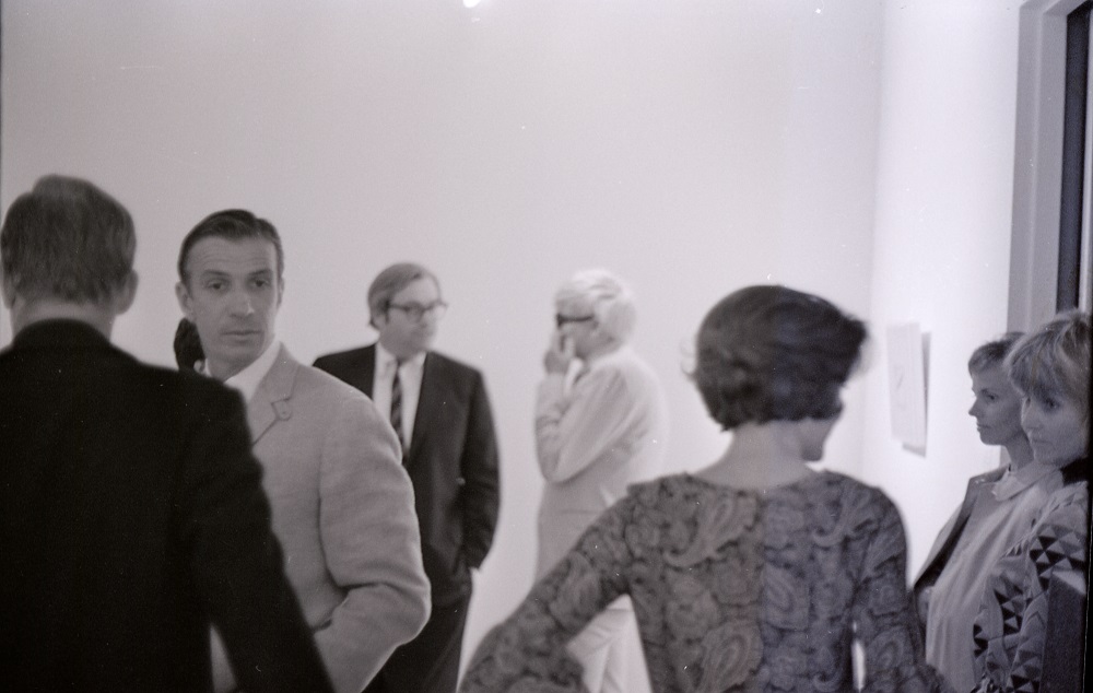 David Hockney in the background.