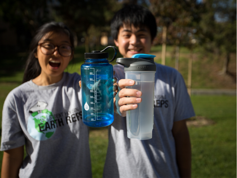 students holding refillable water bottles