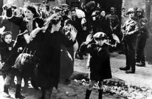 Operations in the Warsaw Ghetto in April and May of 1943 to empty the Ghetto and deport its remaining holdouts — men, women and children. Image via the New York Times.