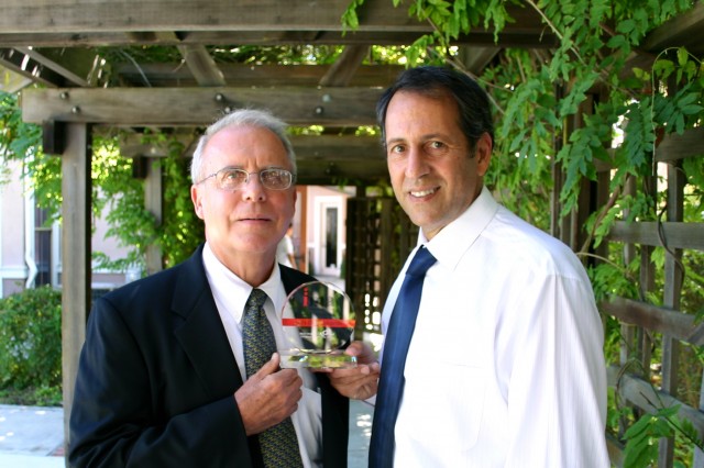 Gary Matkin and Larry Cooperman holding the Interet Marketing Association's award for "Best Website Content."