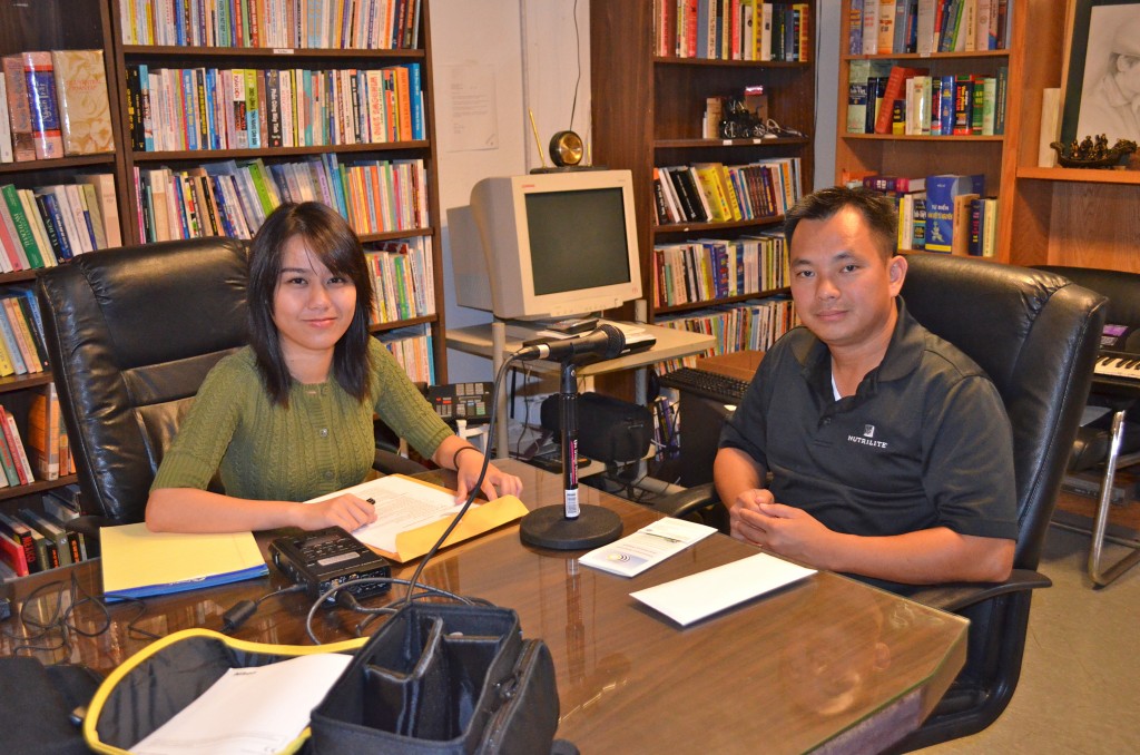 UCI student, Tram Vo, interviewing La Quoc Tam at Vien Dong Daily News
